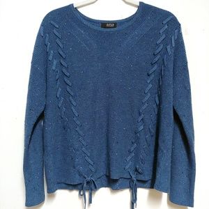 Blue knit sweater with lace-up detail